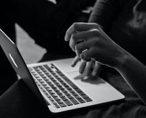Hand on Laptop